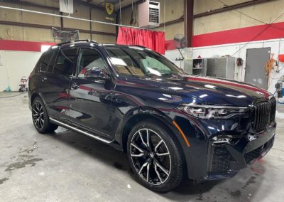 BMW x7 wearing Modesta BC-08 ceramic coating on body and BC-06 on wheels